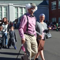 <p>Assistant Principal Alex Harvey and Principal Paula Bleakley led the annual Kindergarten Halloween parade at the Holmes School on Monday, Oct. 31.</p>