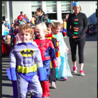 <p>Kindergartners Nolan Cavasina, Leopold Merkt, Isla Ozanne and Mae Barnard, along with their teacher Maureen Epifano, marched in the Holmes School&#x27;s annual Halloween parade on Monday, Oct. 31.</p>