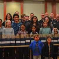 <p>Members of the Danbury Police Department received 150 care packages from children in the Greek Orthodox Youth Association (G.O.Y.A.) to recognize National Make A Difference Day</p>