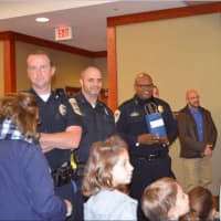 <p>Danbury Police Chief Patrick Ridenhour (right) thanks all the children, parents and church leaders who were in attendance at the event.</p>