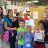 <p>Parents and their children participate in Neighbors Link Stamford&#x27;s Summer Reading Program</p>