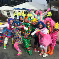 <p>While the wind drove the large balloons away, nothing can keep clowns away from the UBS Parade Spectacular on Sunday.</p>