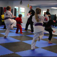 <p>Preteens class working on their front kick</p>