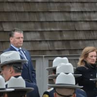 <p>State Sen. Terrence Murphy and Putnam County Executive MaryEllen Odell go outside following the funeral services for Putnam County Undersheriff Peter Convery.</p>