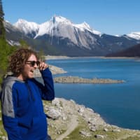 <p>Connor Callanan, a graduate of North Rockland High School, enjoys the view of a snow-capped mountain at Moraine Lake in Oregon.</p>