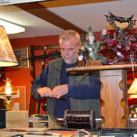 <p>Larry Kahn with some of the knives he sells at Affordable Swordables in Brookfield</p>