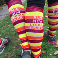 <p>Heather Crum and Vanessa Sinnott, both from Fairfield model the matching socks &quot;Run Now Gobble Later&quot;  they wore for the Pequot Club Thanksgiving Day Road Race.</p>