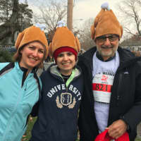 <p>Fairfield resident Heather Crum, her father James Weil, from Asheville, North Carolina, and Vanessa Sinnott, also from Fairfield sported turkey hats for the race.</p>