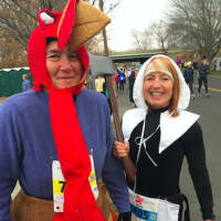 <p>Mary Money, Fairfield, and Michelle Friedman, Norwalk, who dressed respectively as a Pilgrim woman armed with an axe and a turkey hoping to escape that axe at the Pequot Club Thanksgiving Day Road Race.</p>