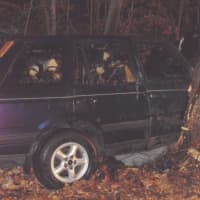 <p>The damaged Range Rover from which a Stamford man was rescued before fire engulfed its interior cabin.</p>