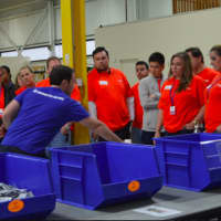 <p>Volunteers from Voya Financial helping to fill first aid kits at Americares in Stamford</p>