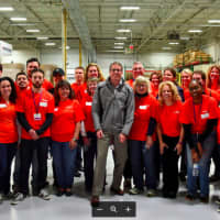 <p>Volunteers from Voya Financial, along with Americares President and CEO Michael J. Nyenhuis in the middle, center</p>