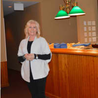<p>Linda Shakro at the bar at Michael&#x27;s at the Grove in Bethel</p>