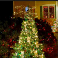 <p>A Christmas tree at the home of Newtown couple Rhonda and Chane Cullens with 26 angel-shaped ornaments is dedicated to those who lost their lives in the Sandy Hook tragedy</p>