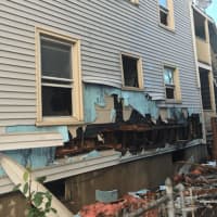 <p>Damage due to a fire at 40 Lockwood Ave., can be seen at the side of the house. Six people were displaced and two firefighters slightly injured. The cause is under investigation.</p>