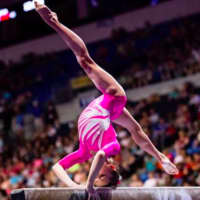 <p>Dunne wows crowds on the beam.</p>