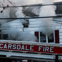<p>Firefighters with the Scarsdale Fire Department are searching for the homeowner who was trapped when the house caught fire on Sunday.</p>