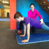 <p>Bridgeport resident Laura Obringer is coached by Michaela Hastings in her Danbury gym</p>