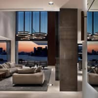 <p>The house&#x27;s sliding glass doors look out onto downtown Miami and the Biscayne Bay.</p>