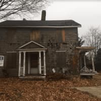 <p>The empty home at 28 Catoonah St. in Ridgefield will finally be razed, with plans to build a pocket park in its place.</p>