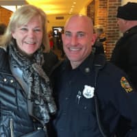 <p>Carol Swift with Officer Jason Levy at Coffee with a Cop in Greenwich Tuesday.</p>
