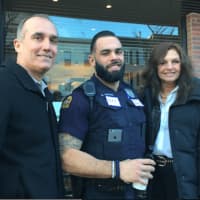 <p>Jack and Suzanne Testani with their son Alexander, a Greenwich Police officer, at Coffee with a Cop in Greenwich on Tuesday.</p>