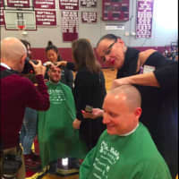 <p>The hair shaving event fundraiser in progress at Bethel High School</p>