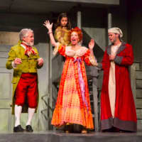 <p>Bob Williams (Mr. Fezziwig) and Lisa Uffer (Mrs. Fezziwig) announce their Christmas party as Anna Stutman (Christmas Past) and James Ludwig (Scrooge) look on</p>