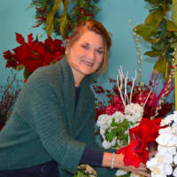 <p>Danna DiElsi enjoys creating silk floral arrangements at The Silk Touch of Norwalk.</p>