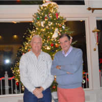 <p>From left, Charlie Micha and Walter Schalk, in front of Walter&#x27;s Christmas tree at his Wilton home.  Schalk has an elaborate holiday light decoration outside his home.</p>