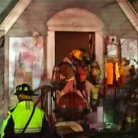 <p>Some flames can be seen at a fire early Wednesday evening in Stamford at 26 Underhill St.</p>