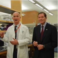 <p>Dr. Paul Fiedler shows U.S. Sen. Richard Blumenthal the research for Lyme disease detection that is taking place at the Western Connecticut Health Network Biomedical Research Institute in Danbury.</p>