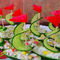 <p>Super Duper Grub offered these cucumber boats stuffed with chicken and tuna salad for a private party.</p>
