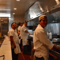 <p>staff in the kitchen at Red Rooster Pub in Newtown</p>