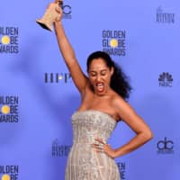 <p>Tracee Ellis Ross with her 2017 Golden Globes award.</p>