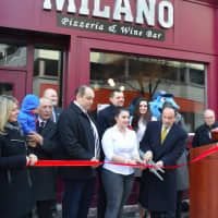 <p>Bridgeport Mayor Joe Ganim, right, helps cut the ribbon to officially open Milano Wine Bar &amp; Pizzeria on Fairfield Avenue.</p>