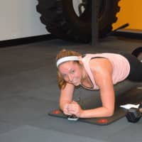 <p>New Canaan resident Kerry Nowacki does a plank.</p>