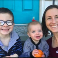 <p>Trumbull resident Ashley Gaudiano with her two children on her front steps, taken right after she voted for Sen. Hillary Clinton for president.</p>