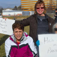 <p>People express their views in their signs at the Women&#x27;s March on Stamford on Saturday.</p>