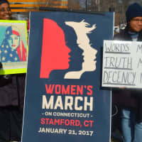 <p>Many people hold up signs at the Women&#x27;s March on Stamford on Saturday.</p>