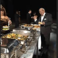<p>Attorney Bob Yamin checks the buffet at the Freedom Ball in Washington, D.C.</p>