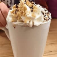 <p>Rocky Road hot chocolate topped with whipped cream and crushed peanuts at Sogno Coffee in Westwood.</p>