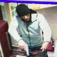 <p>The suspect in an armed bank robbery in Greenwich, Conn., Wednesday afternoon. He&#x27;s been sought in Port Chester after crashing and abandoning his car during a police pursuit, and then stealing a pickup truck to flee to the Bronx from Port Chester.</p>