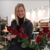 <p>Christina Foley is a wedding planner at Flowers By Whisconier in Brookfield.  She is holding up the heart rose, which the shop is featuring this Valentine&#x27;s Day.</p>
