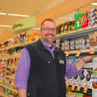 <p>Assistant Store Manager Joe Casso showing the expanded healthy foods section</p>