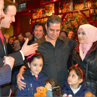 <p>Kassar and his family, who are Syrian refugees, at the Olive Tree in Milford on Friday evening. The restaurant’s owner, Sammer Karout, is the brother-in-law of Kassar.</p>