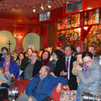 <p>A packed crowd fills the Olive Tree in Milford awaiting the arrival of the Syrian refugee mother and her two daughters.</p>