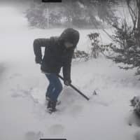 <p>12-year-old Hannah McGuire shoveling snow in her Bethel driveway.</p>