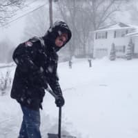 <p>Danbury resident Barry Abrams shoveling snow in his driveway</p>