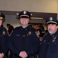 <p>Chief James Purcell, left, and Major John Puglisi, right welcome Pete Frengs as the new captain of the Brookfield Police Department.</p>